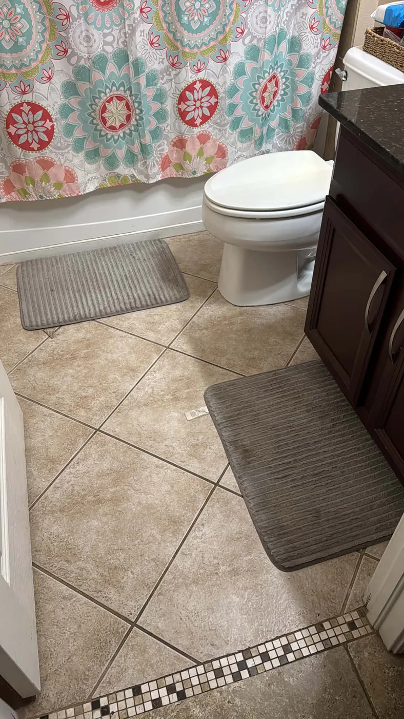 Clean bathroom tile floor and fixtures in a Tampa, FL home